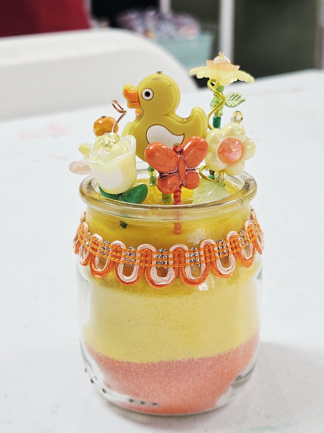 Yellow/Orange beaded flower jar with duck