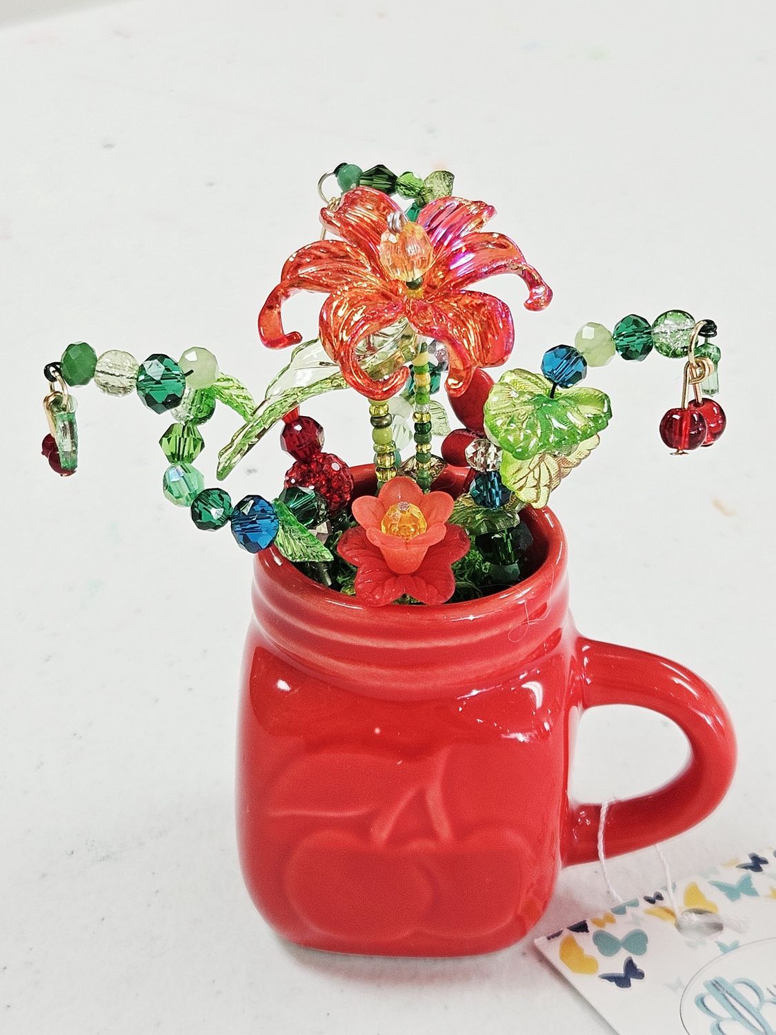 Red cherry jar with beaded flowers