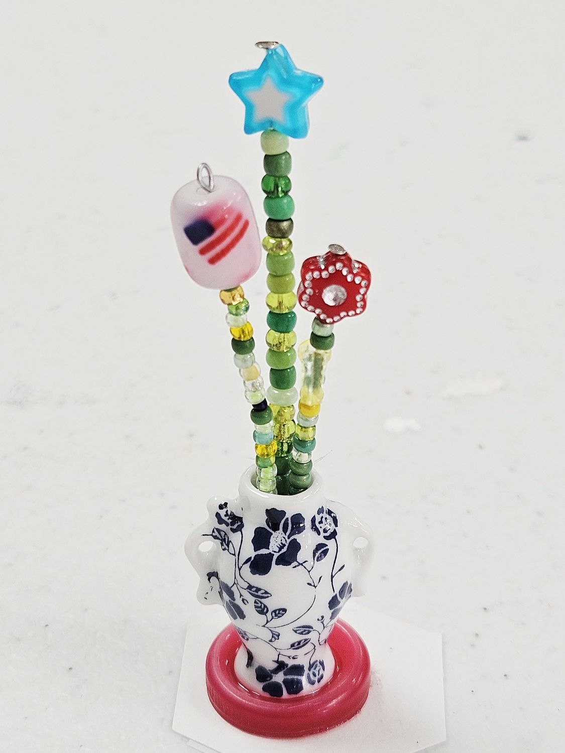 Patriotic Beaded Flowers in Blue/White Ceramic Vase