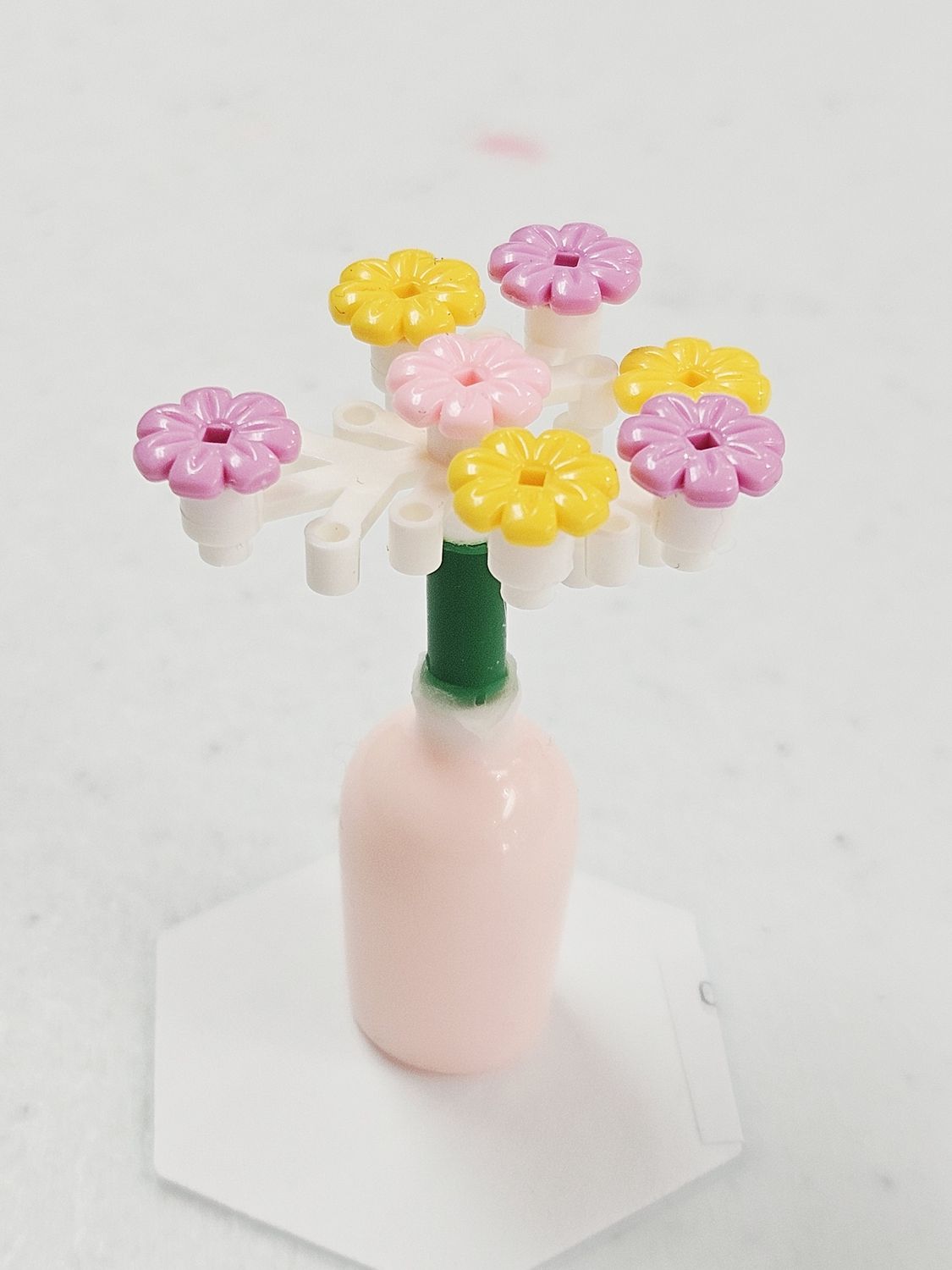 Micro Yellow, Purple, Pink flowers in pink vase