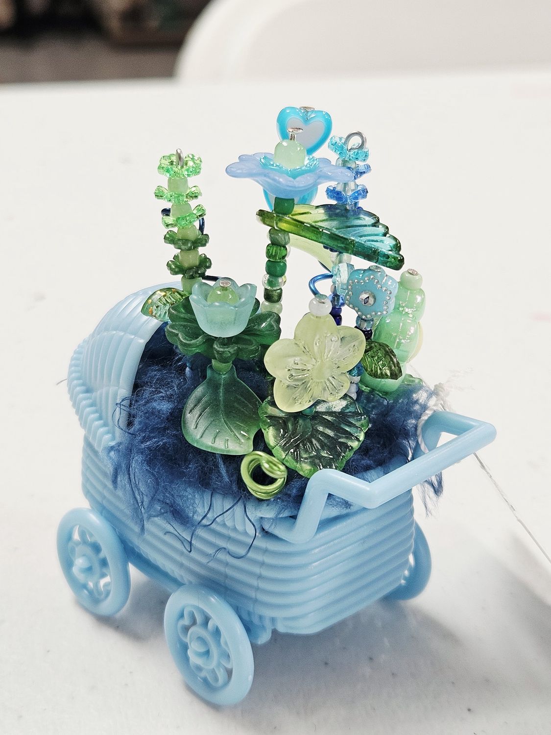 Blue Baby Buggy with Beaded Flowers