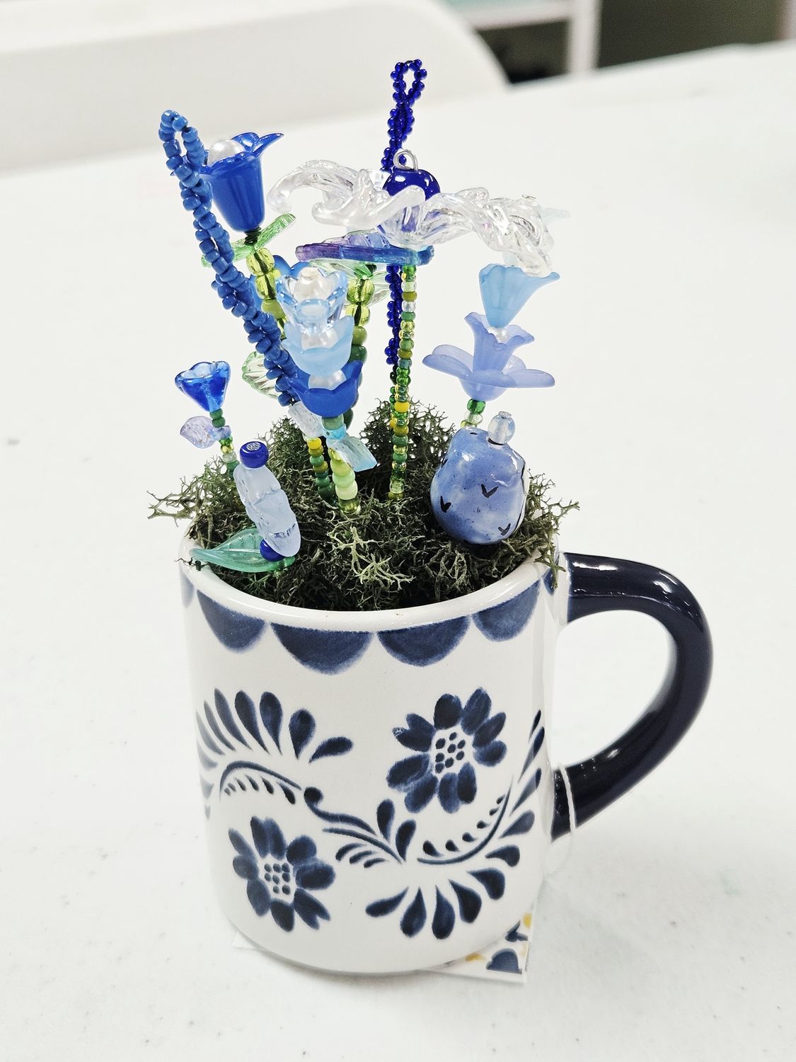 Blue Beaded flowers in Blue/White cup