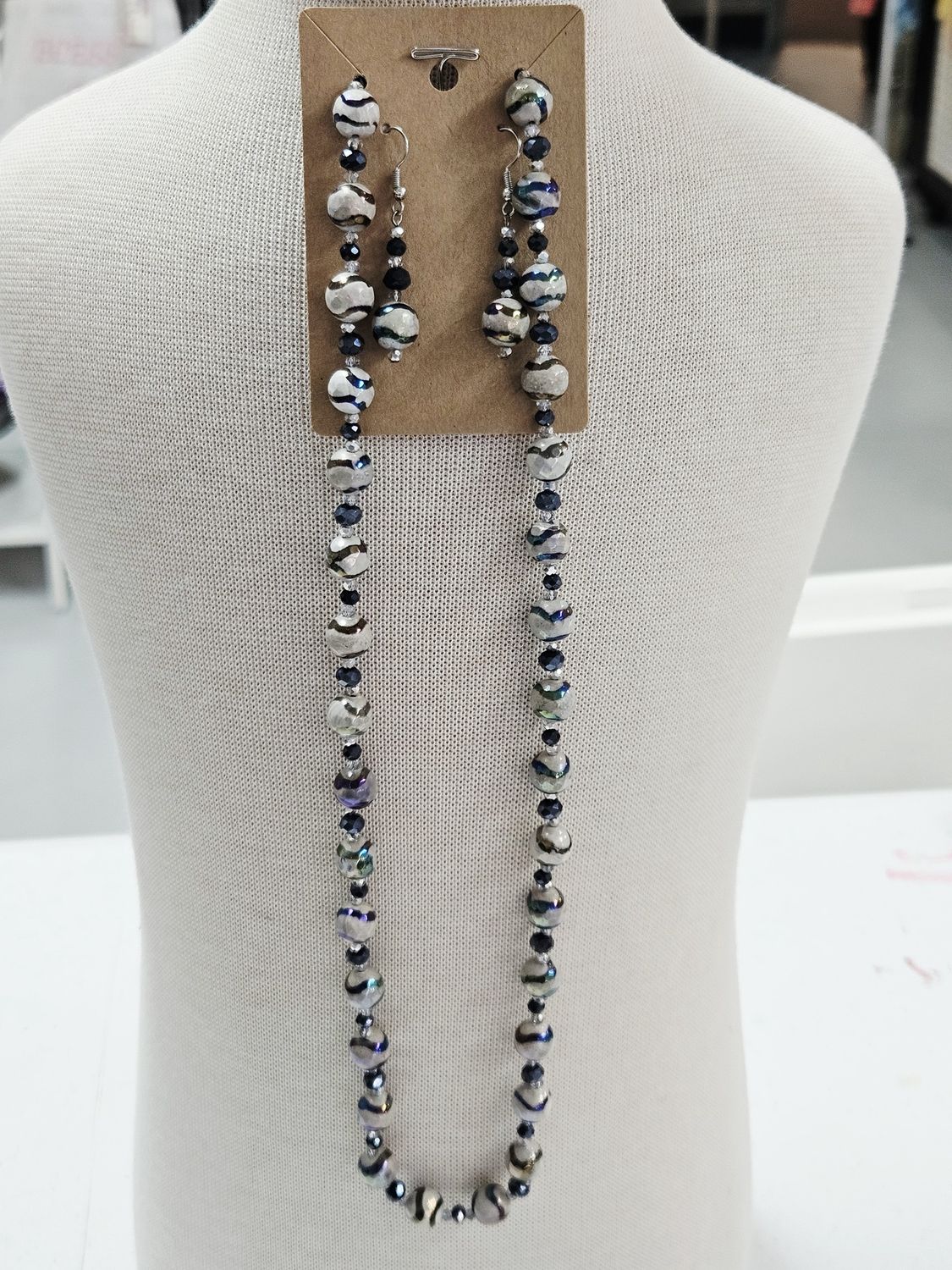 Irridescent wavy design beaded necklace and earring set