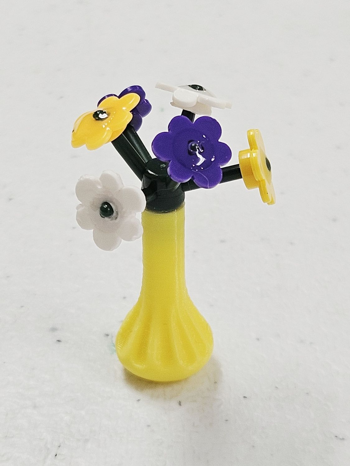 Purple &amp; Yellow building block plant in yellow vase