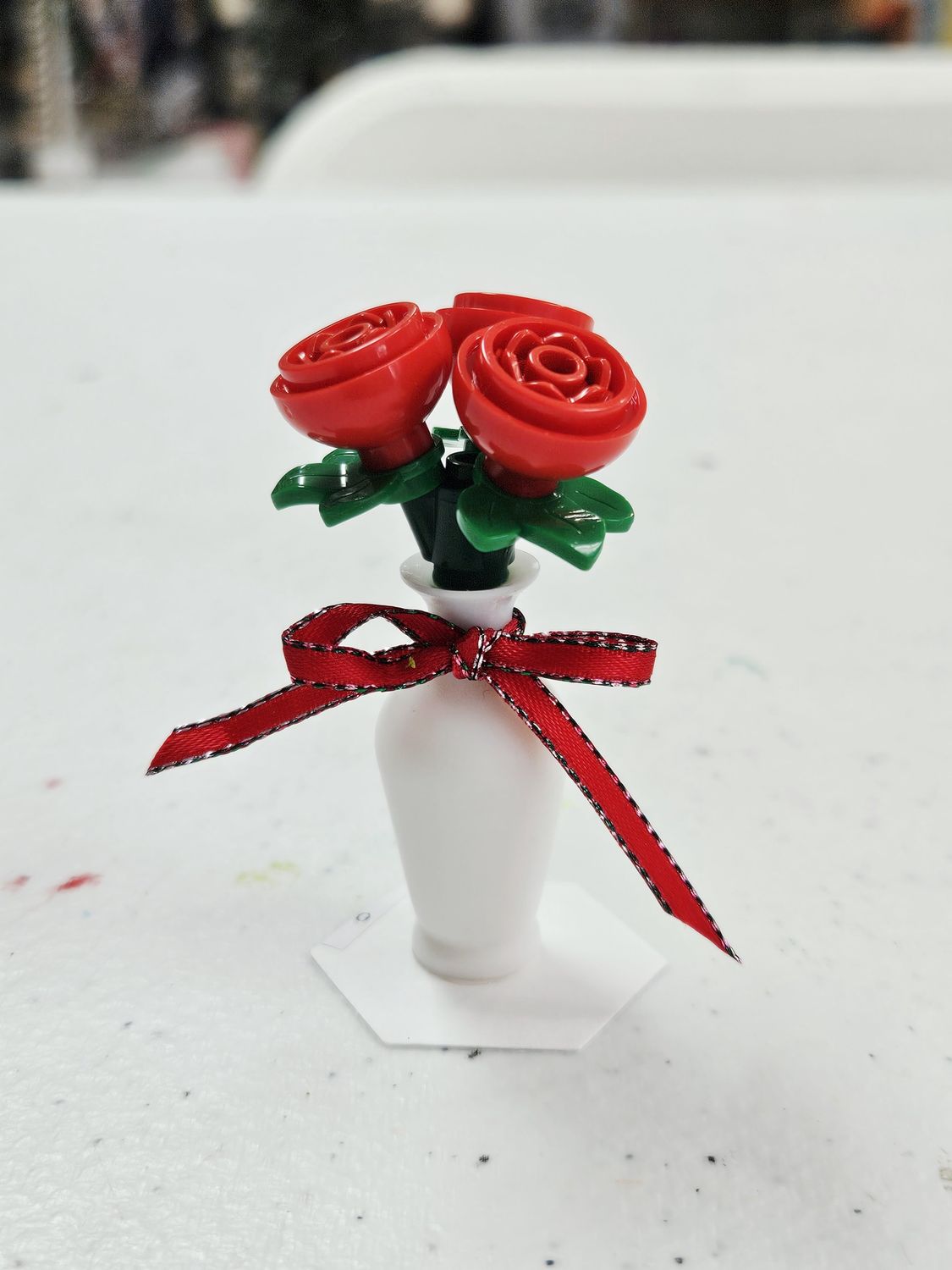 3 Red roses in White vase with red ribbon