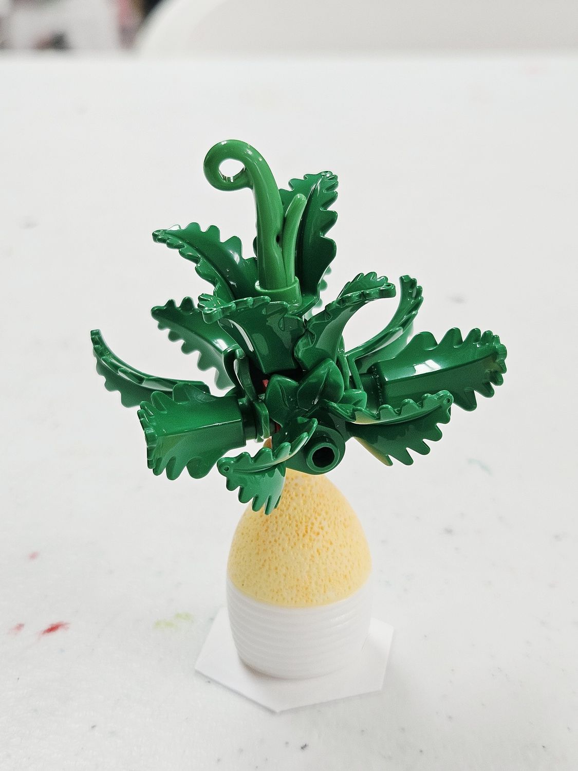 Fern Like Building Block Plant in Yellow/White Vase