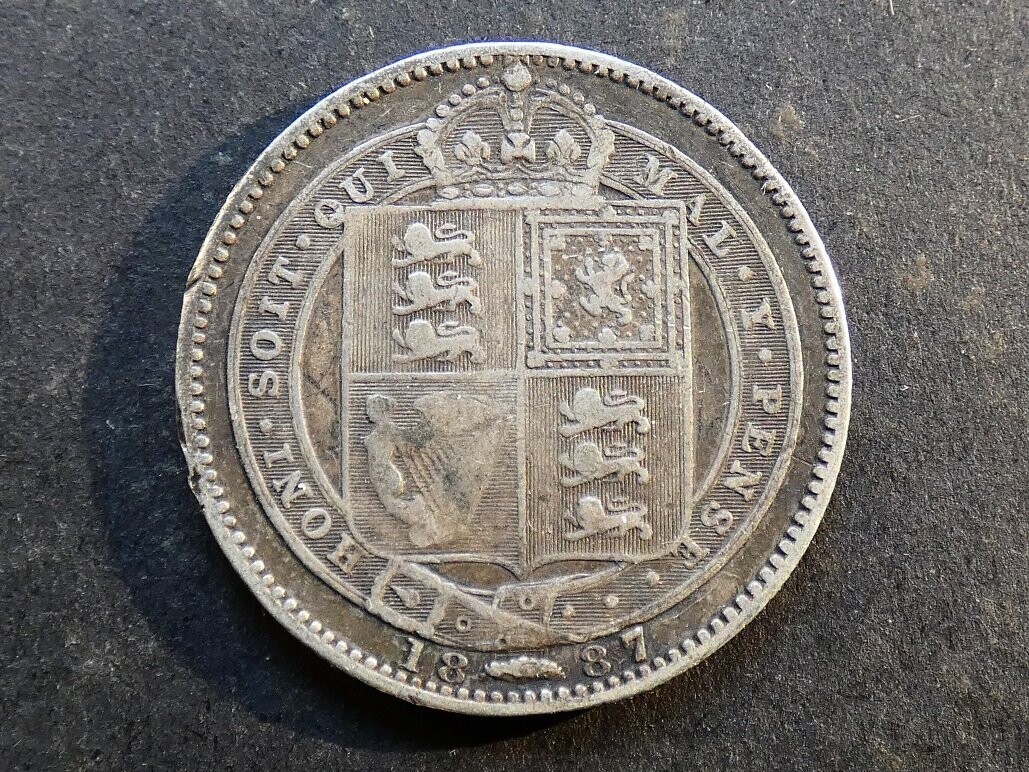Shilling, 1887, Jubilee issue, garter points between teeth.