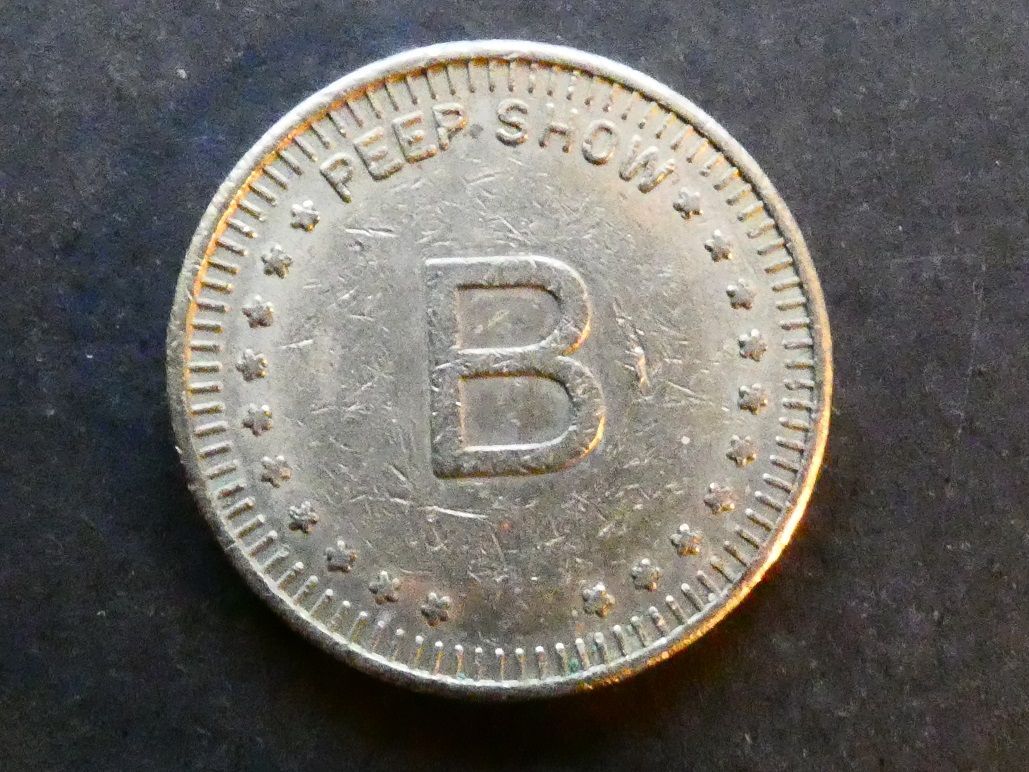 USA, peep show token. USA, peep show token.