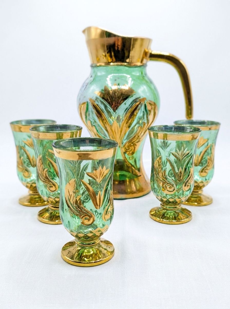 Elegant vintage green glass pitcher and goblet