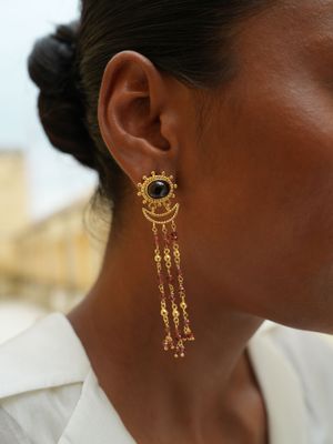 model wearing christine bekaert jewelry handcrafted gold-plated sippar earring with natural gemstones smokey quartz