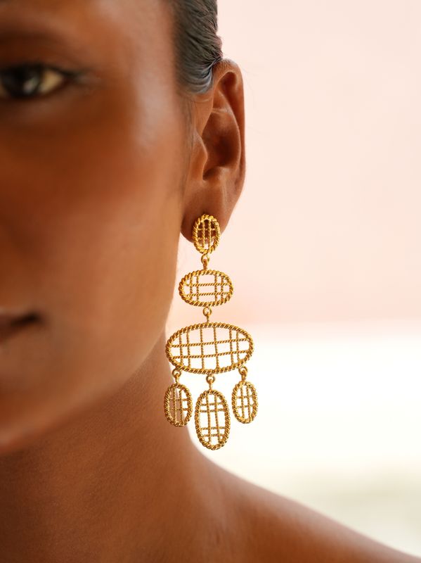 model wearing christine bekaert jewelry handcrafted gold-plated sitara large statement dangle earrings 