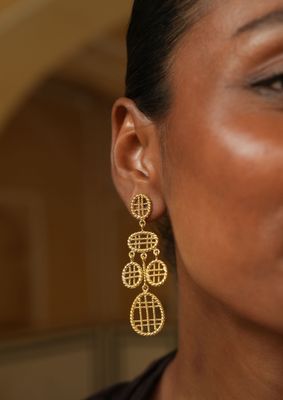 model wearing christine bekaert jewelry handcrafted gold-plated sitara small dangle earrings 