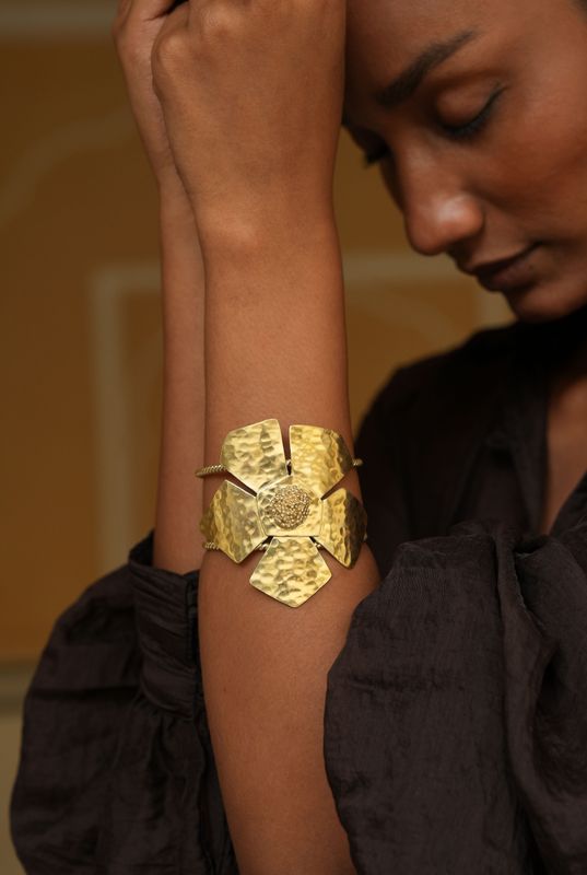 model wearing Christine bekaert statement jewelry handcrafted gold-plated everbloom cuff bracelet with adjustable size