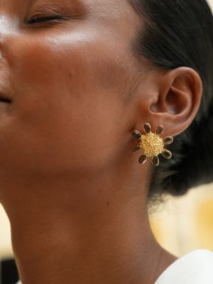 model wearing Christine Bekaert Jewelry statement earrings studs forever floret gemstones smokey quartz handcrafted