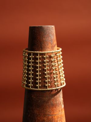 product photo christine bekaert jewelry handcrafted gold-plated nerigal statement cuff bracelet with adjustable size