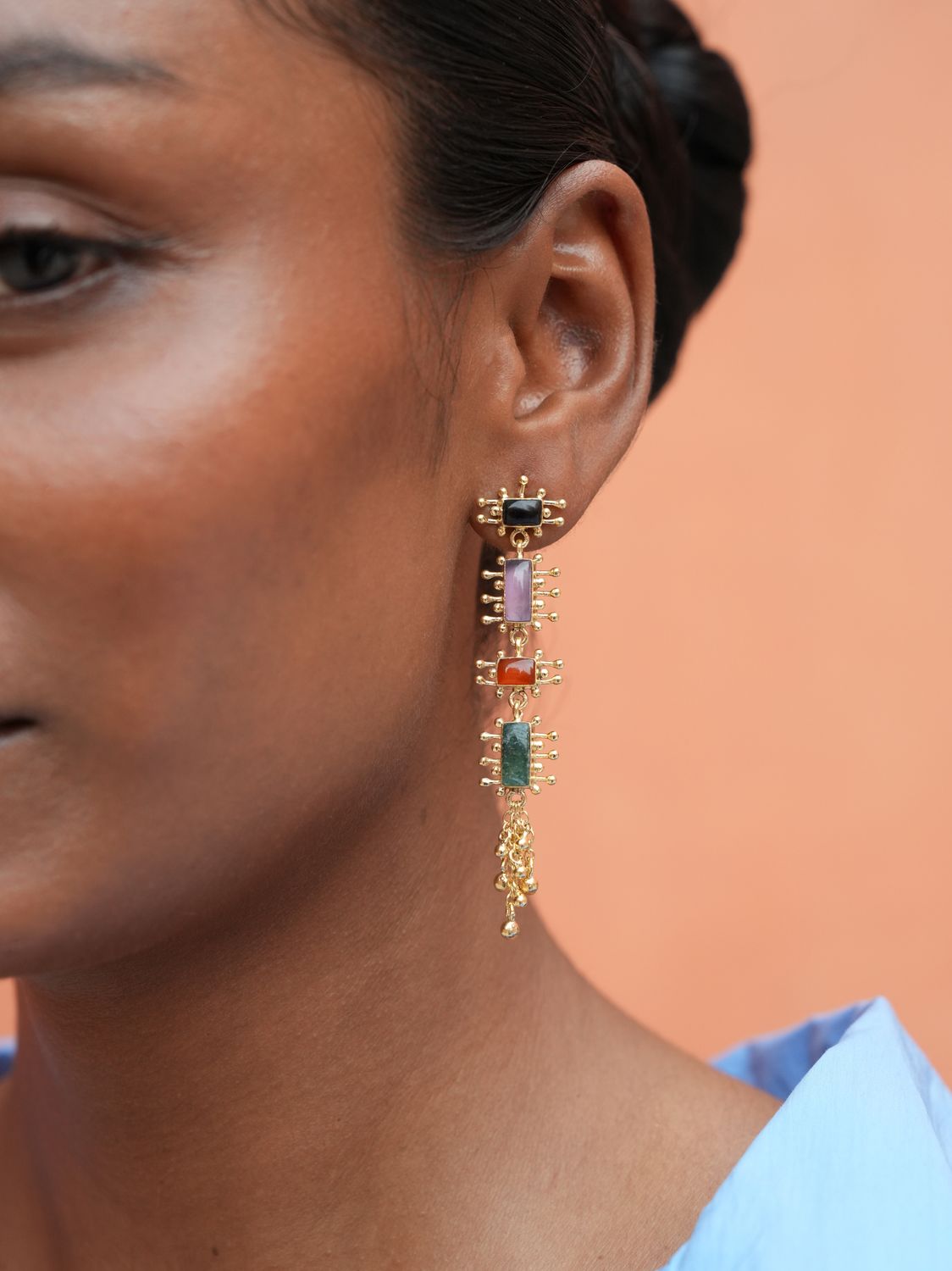 model wearing Christine Bekaert Jewelry earrings multi gemstones 
