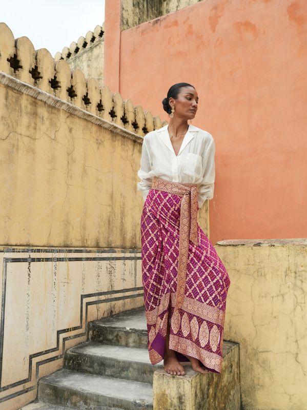 Model wearing unique, statement wrap around skirt from hand embroidered and tie&amp;die saree designed by Christine Bekaert 