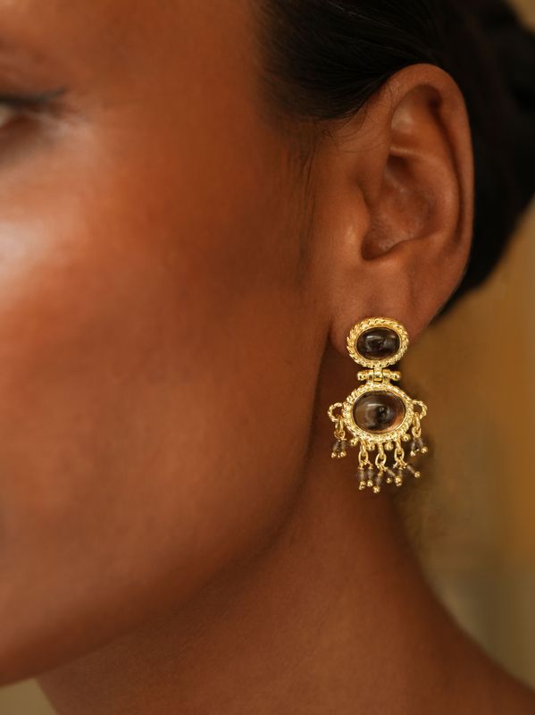 model wearing christine bekaert jewelry handcrafted gold-plated neberu earrings with gemstones smokey quartz