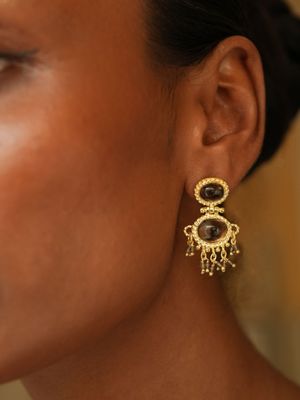 model wearing christine bekaert jewelry handcrafted gold-plated neberu earrings with gemstones smokey quartz