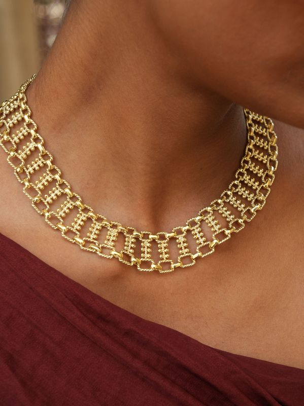 model wearing christine bekaert jewelry handcrafted gold-plated nerigal statement necklace with adjustable length