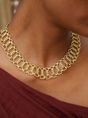 model wearing christine bekaert jewelry handcrafted gold-plated nerigal statement necklace with adjustable length