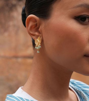 Product shot of small flower earrings with amazonite by Belgian Christine Bekaert handcrafted statement jewelry on model