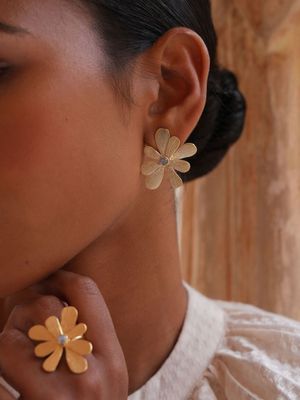 Product shot of medium flower earrings with smokey quartz by Belgian Christine Bekaert handcrafted statement jewelry on model