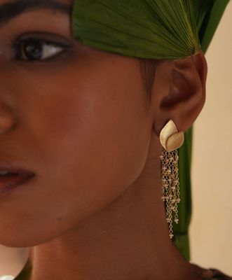Product shot of medium flower earrings with gold beads by Belgian Christine Bekaert handcrafted statement jewelry 