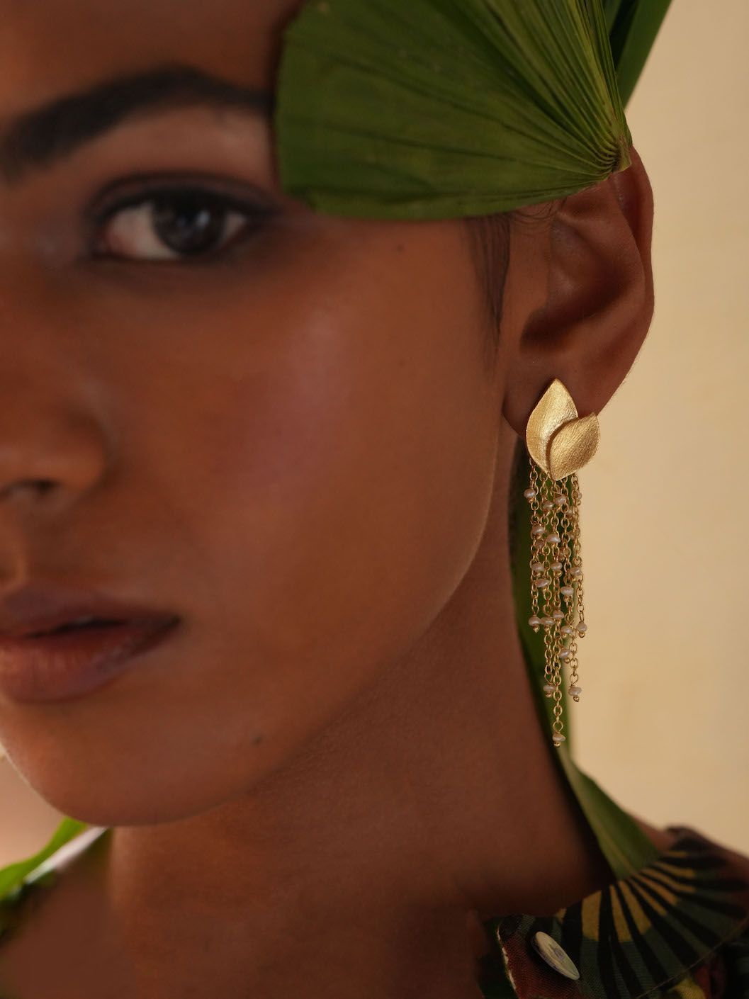 Product shot of medium flower earrings with amazonite by Belgian Christine Bekaert handcrafted statement jewelry on model