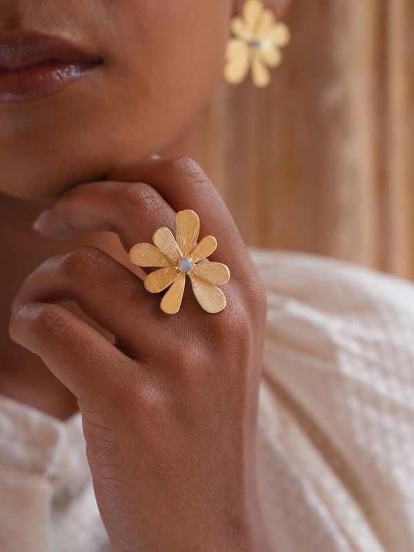 Product shot of adjustable flower ring with labradorite by Belgian Christine Bekaert handcrafted statement jewelry on model