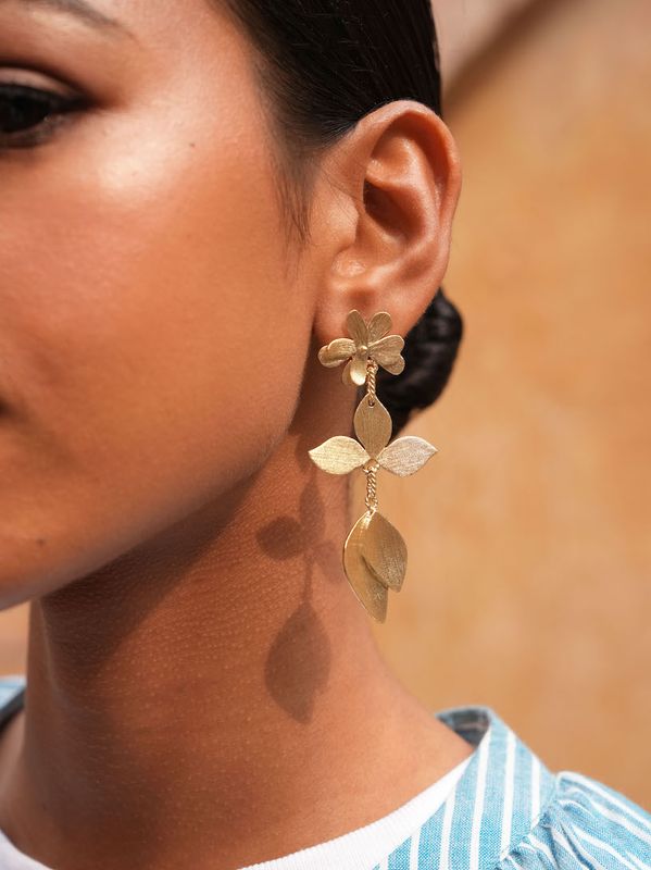 Product shot of large flower earrings with labradorite by Belgian Christine Bekaert handcrafted statement jewelry on model