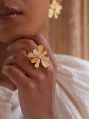 Product shot of adjustable flower ring with amethyst by Belgian Christine Bekaert handcrafted statement jewelry on model
