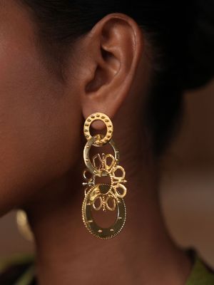 Product shot of large circular earrings by Belgian Christine Bekaert handcrafted statement jewelry on model