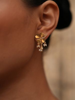 Product shot of small clover earrings with white moonstone by Belgian Christine Bekaert handcrafted statement jewelry model