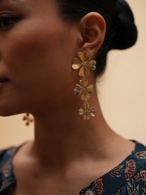 Product shot of large clover earrings by Belgian Christine Bekaert handcrafted statement jewelry on model