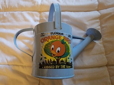 Orange Bird Flower and Garden Festival 2022 watering tin