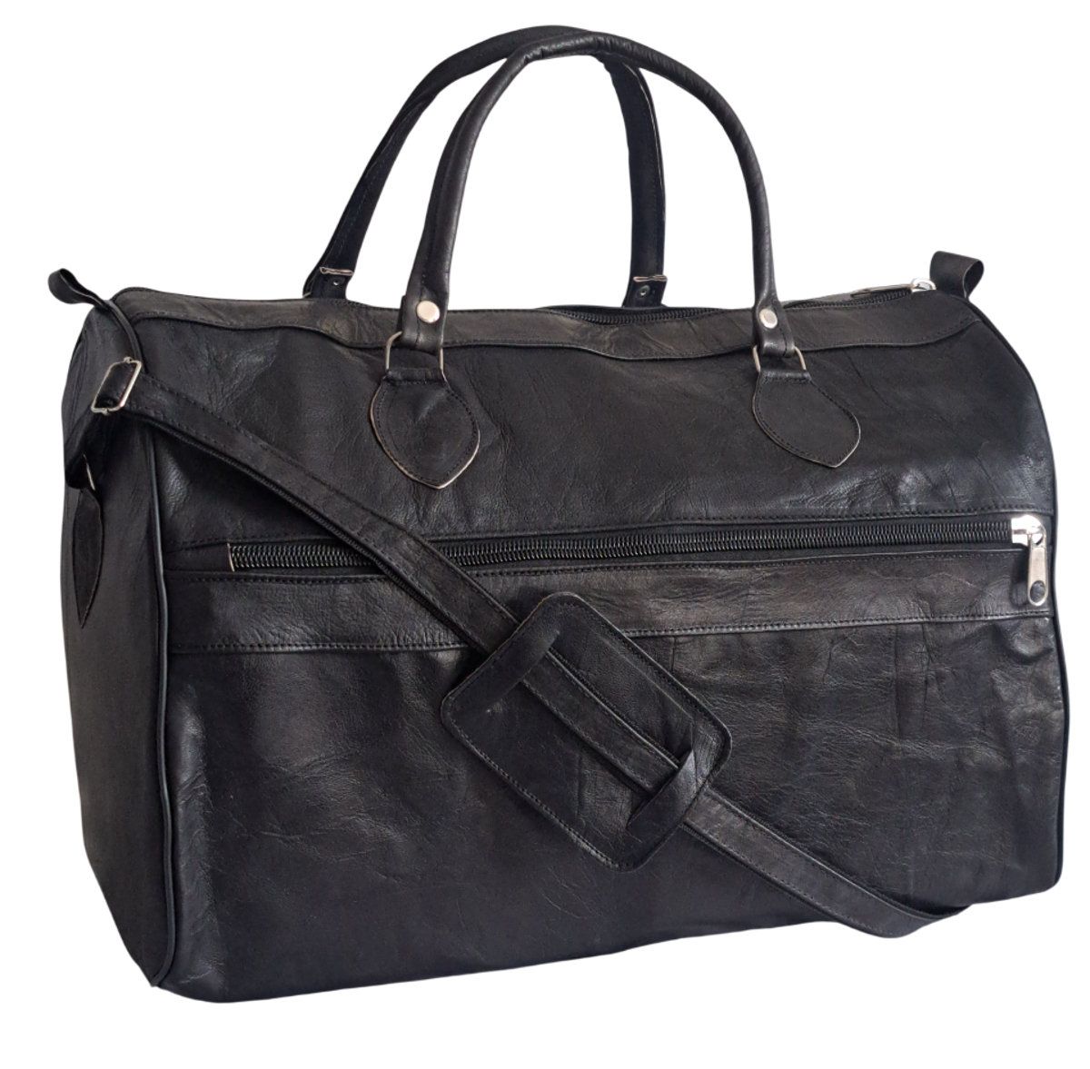 Handgefertigte Reisetasche aus schwarzem Ziegenleder im markanten verwaschenen Look.
