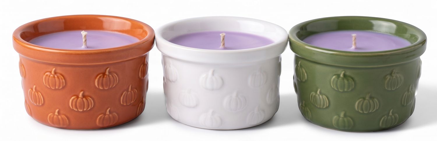 Candle- Pumpkin design on a small vessel