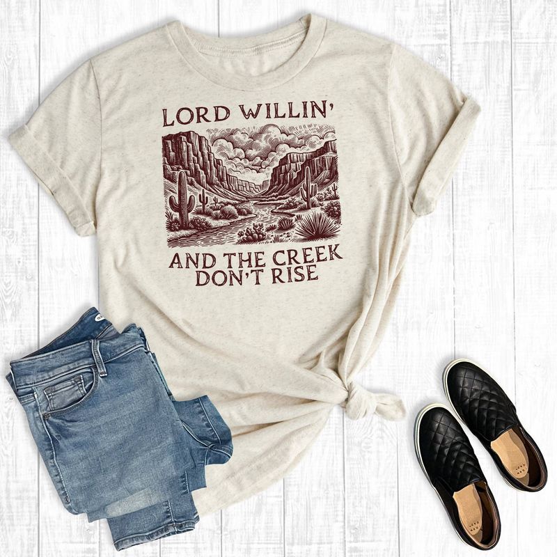 Western Lord Willing And The Creek Don't Rise Graphic Tee: Oat / M / Short Sleeve