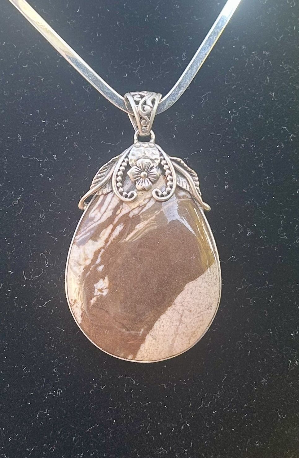 Creamy Brown Jasper set in Sterling,  marked .925, AF 2 1/2” x 1 1/2”.
