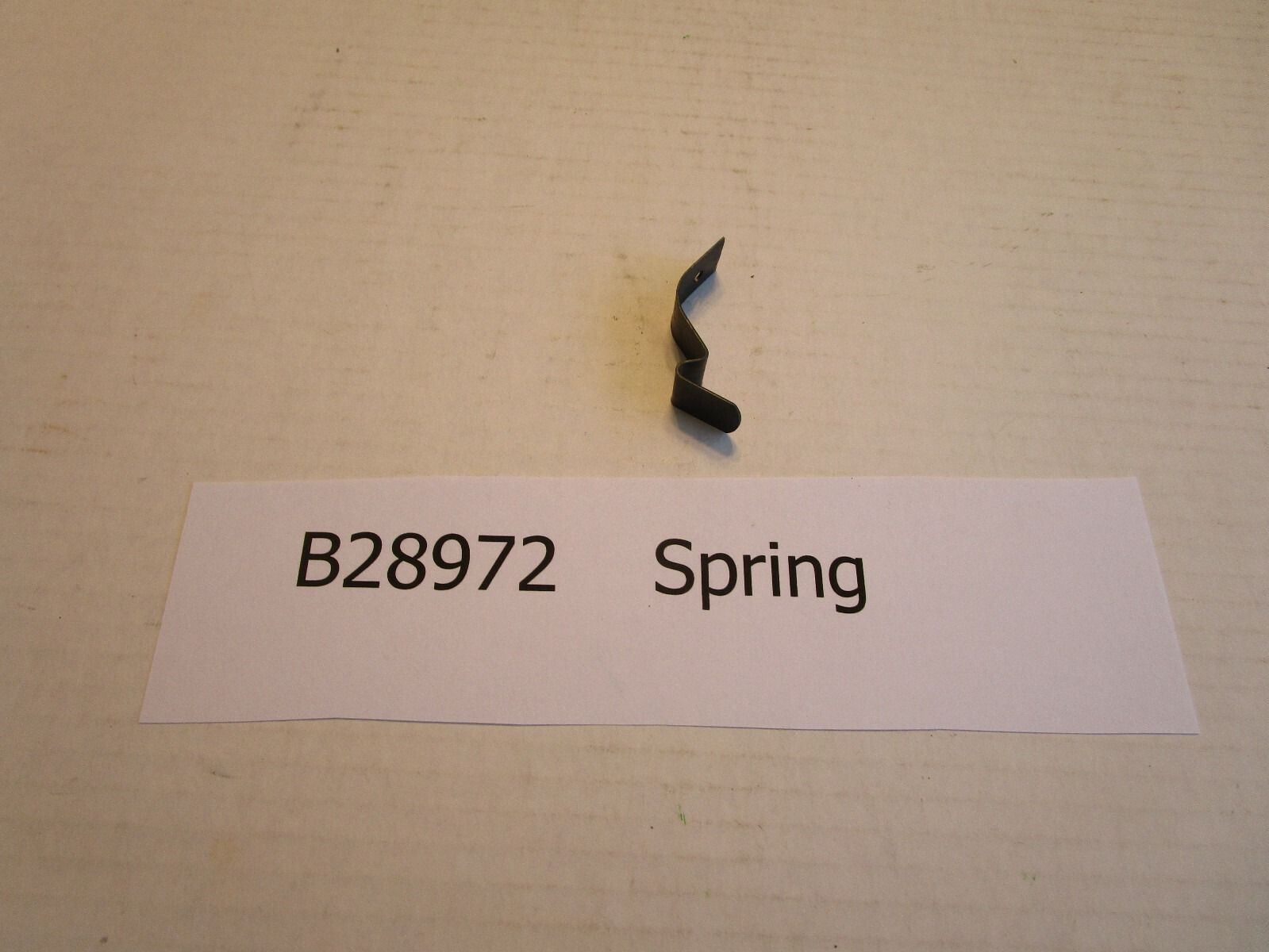 John Deere Planter Part # B28972 Spring for Hopper floor plate, with pop rivet.