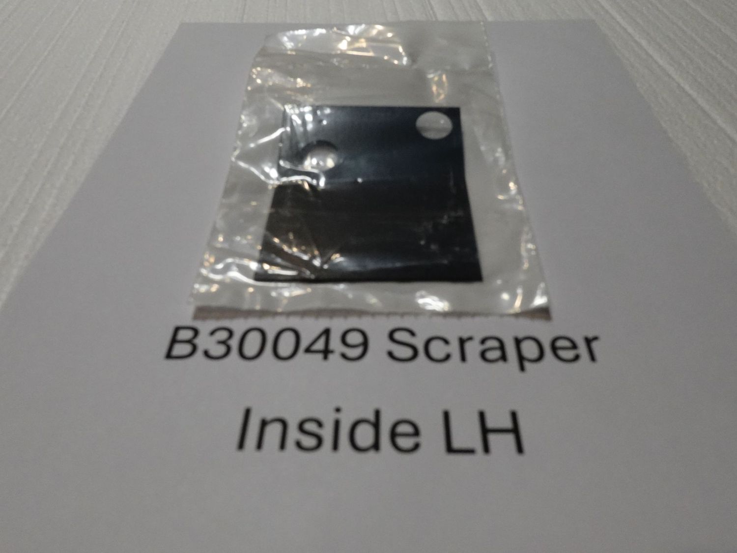 Scraper for inside disc opener LH