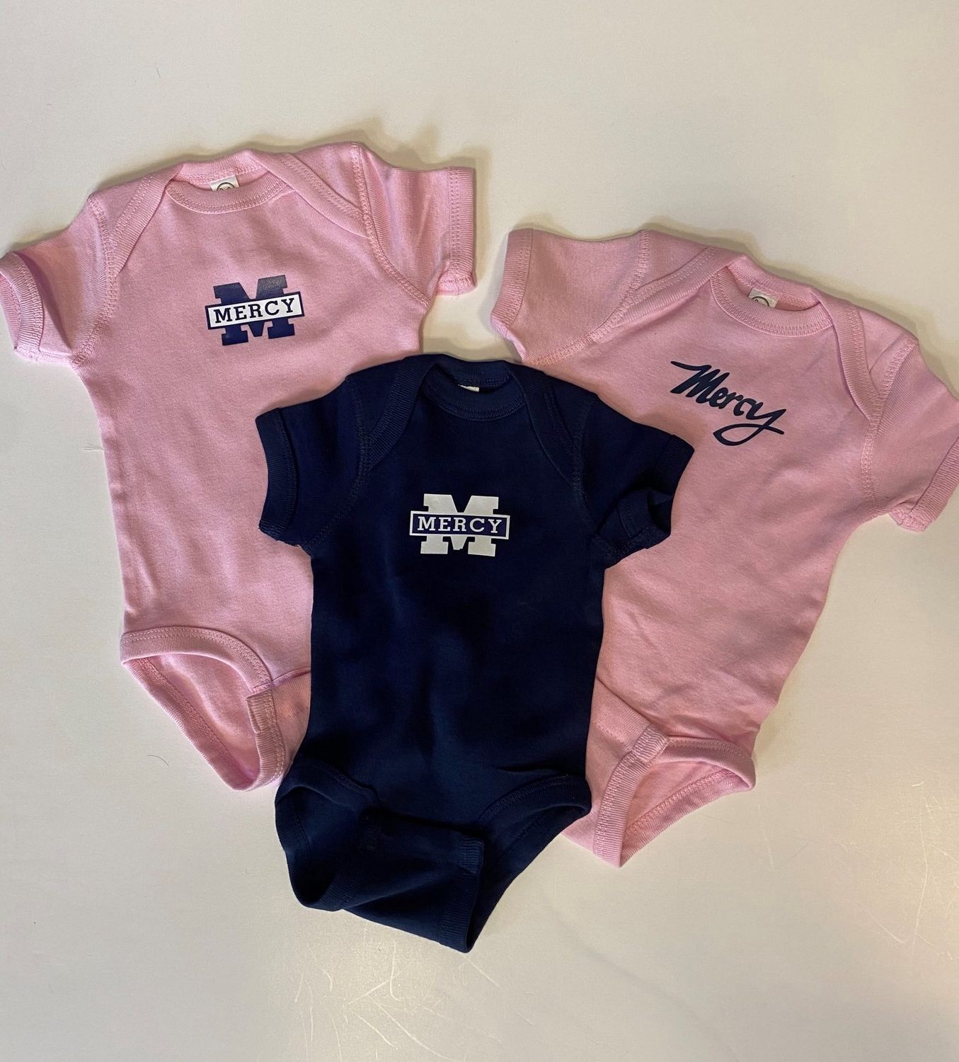 Mercy Baby Onesie(Pink Mercy Script), Sizes: 12 months