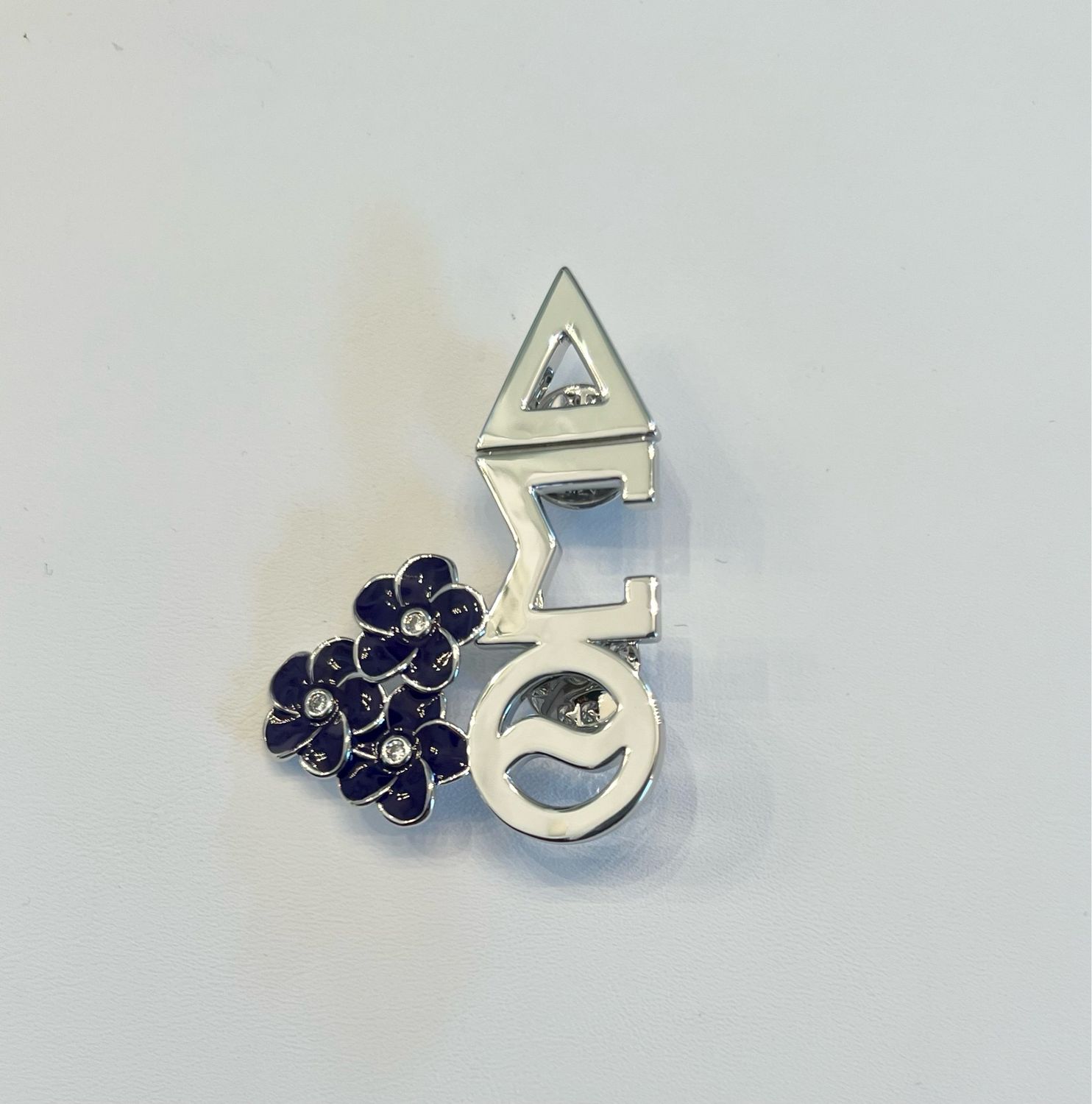 Silver torch W violets pin