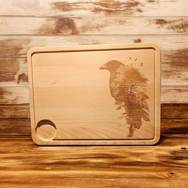 Hevea wood chopping/serving board- Raven design