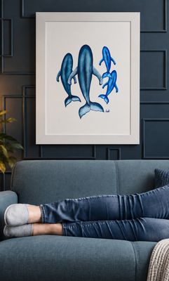 Framed blue whale artwork displayed on a dark panelled wall, representing Newfoundland art at Urban Market 1919.