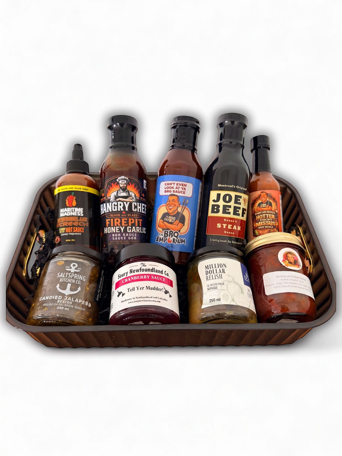 The Saucy One Newfoundland gift basket featuring gourmet BBQ sauces, hot sauces, relishes and specialty condiments.
