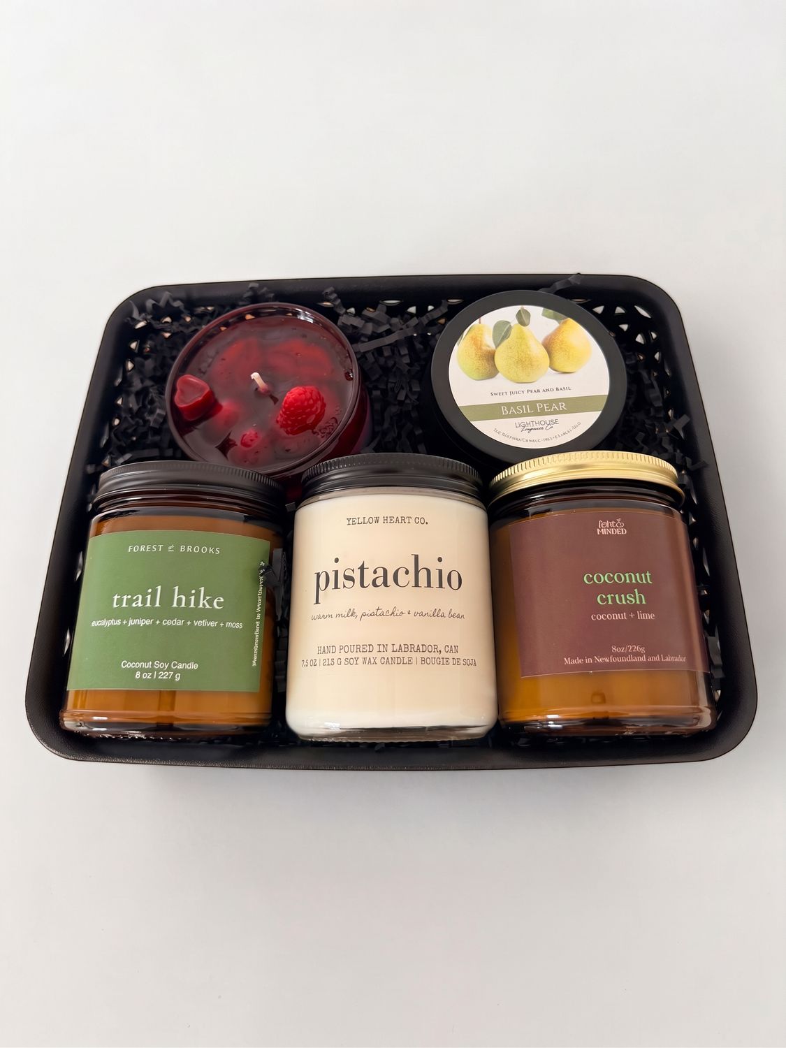 The Urban Glow Newfoundland gift basket featuring five locally made scented candles from Newfoundland candle makers.