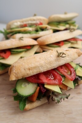 DIY CIABATTA POCKET: freshly baked Ciabata pocket filled with salad greens, cucumber, tomato and your choice spread and filling.