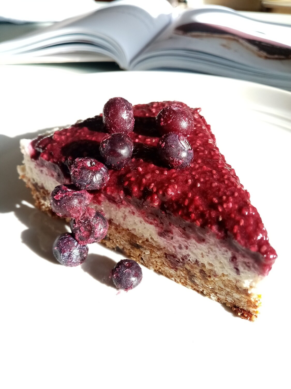 BERRY AND GRANOLA CHEESECAKE. Vegan wanne be cheesecake with Berry chia coulis and a baked nutty, oaty base. Keep chilled. Refined sugar free.